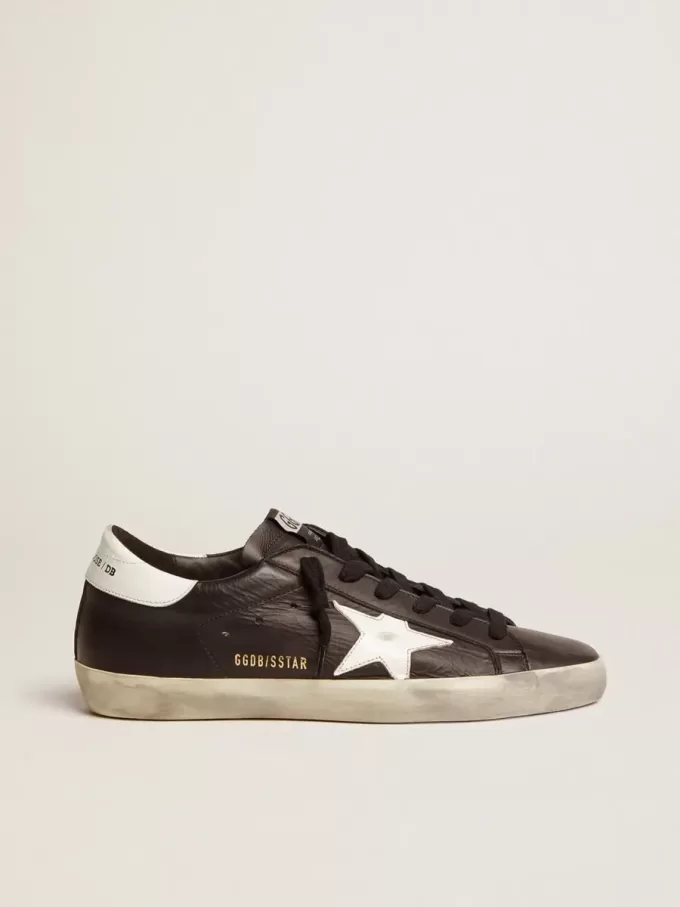 Super-Star voor dames in zwart leer met witte leren ster en hielstuk.