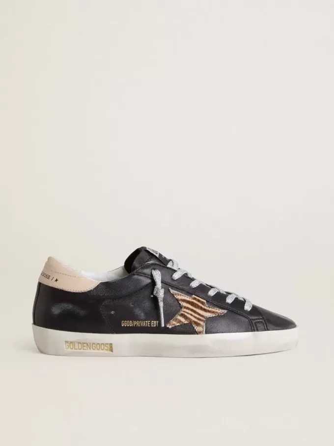 Super-Star voor dames in zwart nappaleer met zebraprint ponyhuidster en beige leren hielstuk