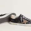 Super-Star voor dames in zwart nappaleer met zebraprint ponyhuidster en beige leren hielstuk