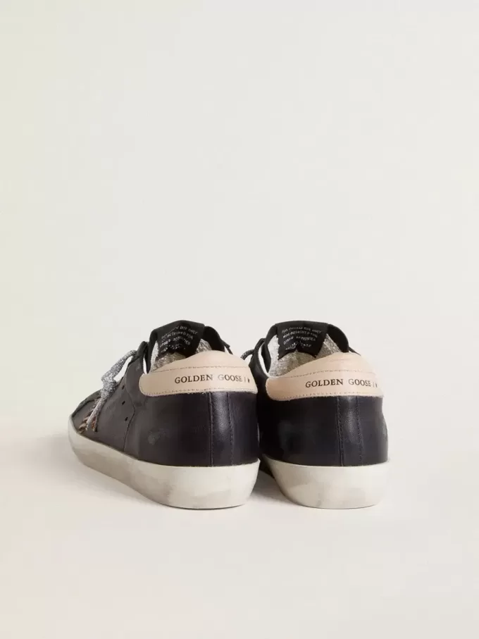Super-Star voor dames in zwart nappaleer met zebraprint ponyhuidster en beige leren hielstuk