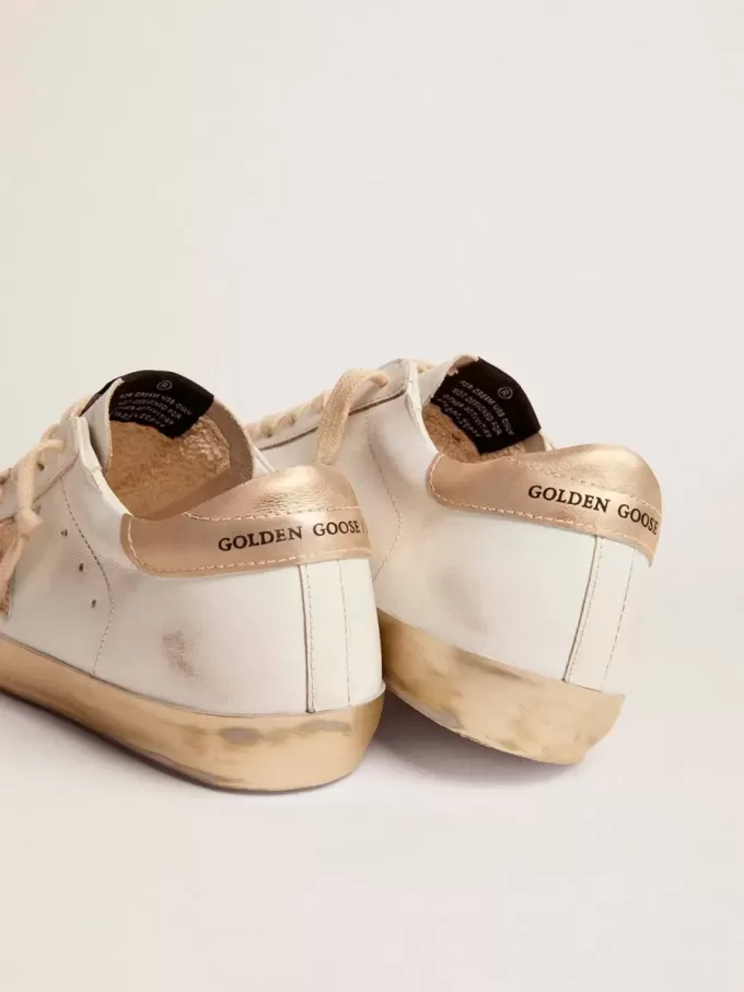 Super-Star voor dames met gouden glitterrand en metalen studs
