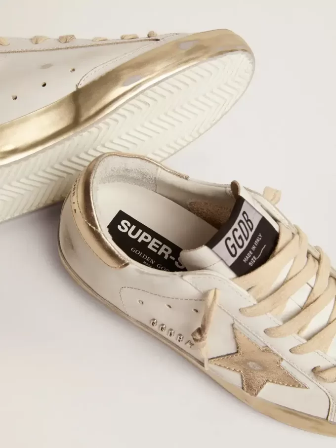 Super-Star voor dames met gouden glitterrand en metalen studs