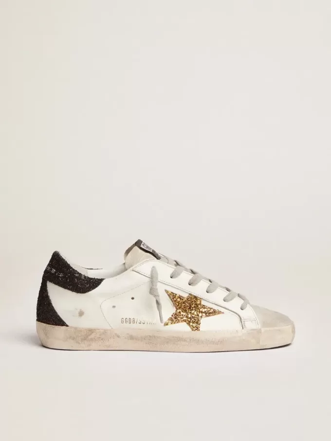 Super-Star voor dames van nappaleer met gouden glitterster en zwarte glitterhaklip.