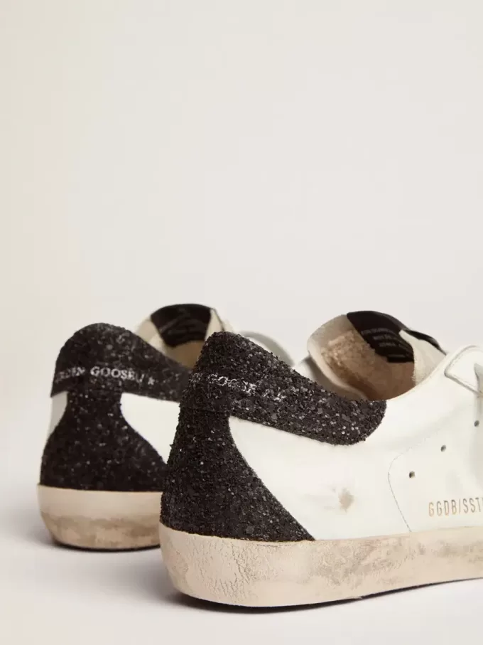 Super-Star voor dames van nappaleer met gouden glitterster en zwarte glitterhaklip.