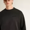 Unisex sweatshirt van versleten zwart katoen met geborduurd logo