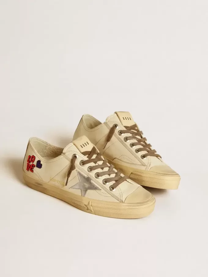 V-Star in ecru nappa met zilveren nappa ster en kralenborduursel