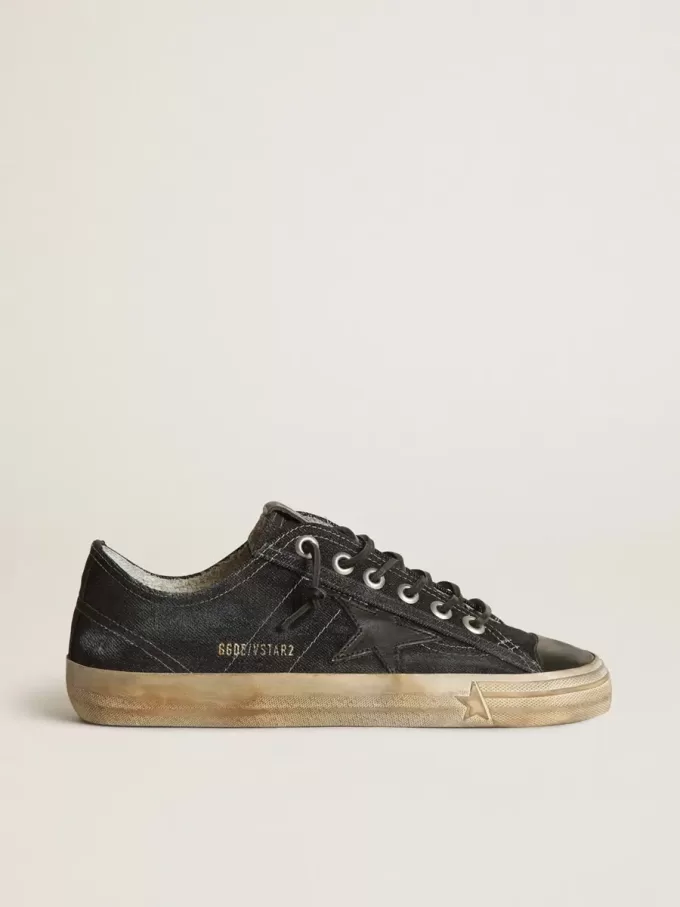 V-Star in middernachtblauw denim met zwarte leren ster en neus
