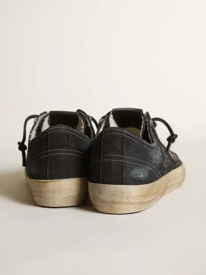 V-Star in middernachtblauw denim met zwarte leren ster en neus