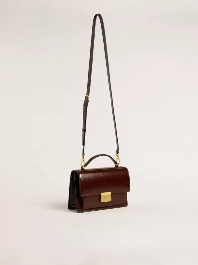 Venezia-tas in donkerbruin gelamineerd leer met gouden details