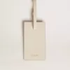 Versleten witte bagagelabel