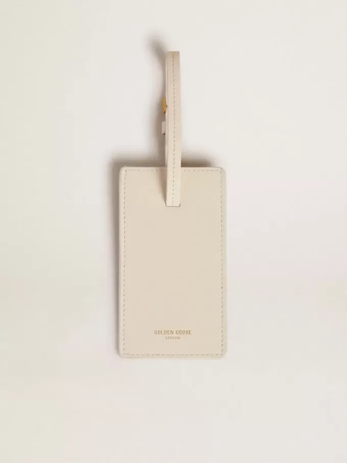 Versleten witte bagagelabel