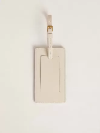 Versleten witte bagagelabel