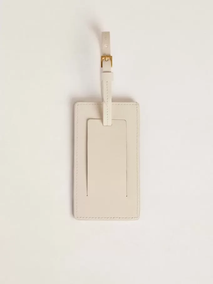 Versleten witte bagagelabel