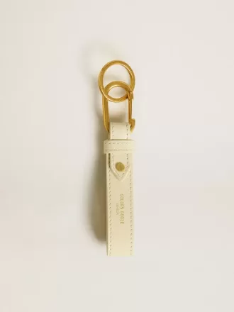 Versleten witte sleutelhanger