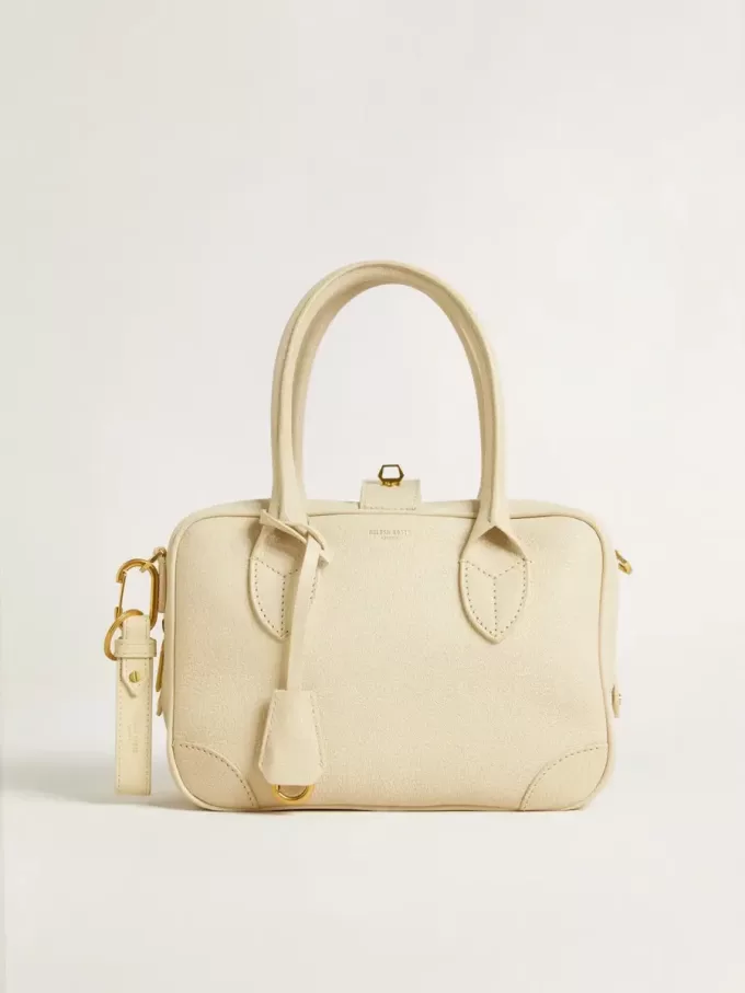 Versleten witte sleutelhanger