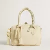 Versleten witte sleutelhanger