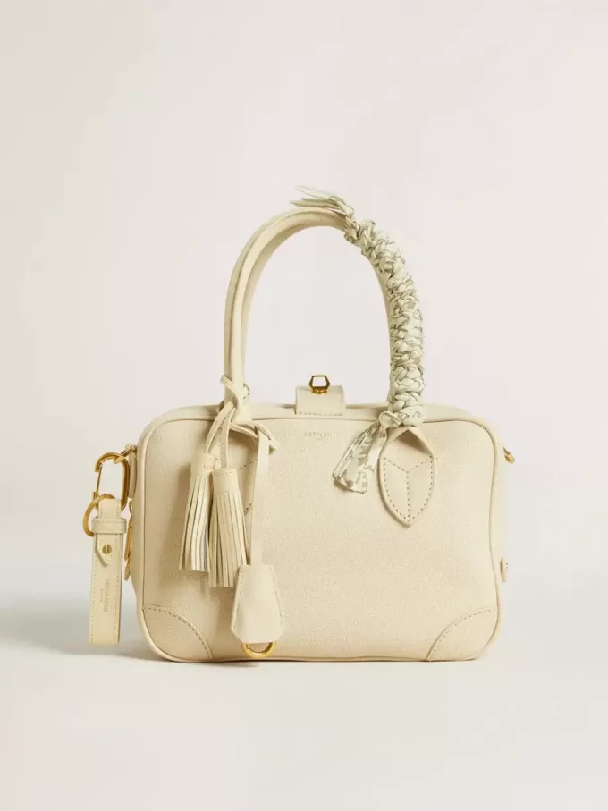 Versleten witte sleutelhanger