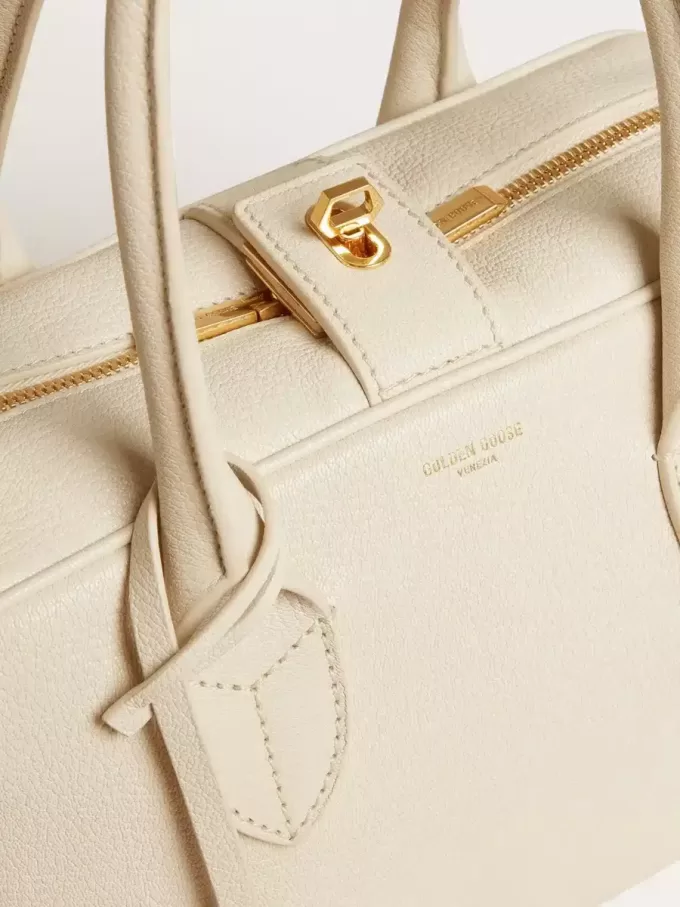 Vita-tas in boterkleurig leer met gouden details