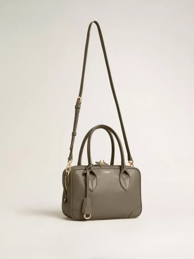 Vita-tas in saliegroen leer met gouden details