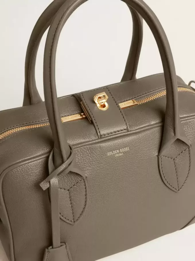 Vita-tas in saliegroen leer met gouden details