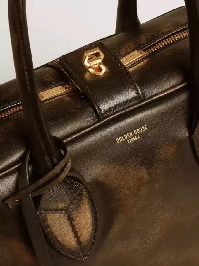 Vita-tas in zwart distressed leer met gouden details