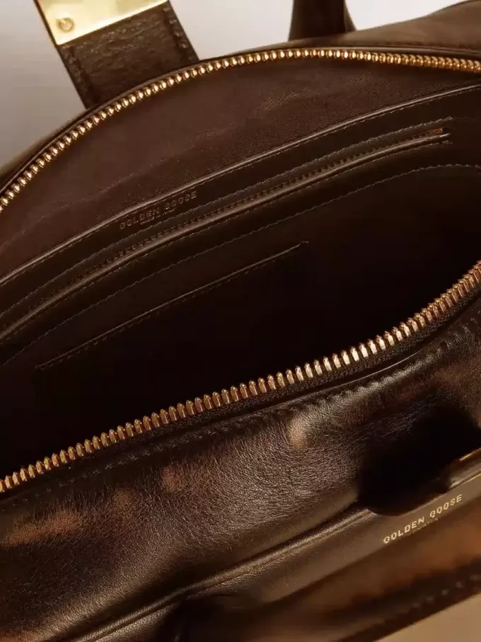 Vita-tas in zwart distressed leer met gouden details