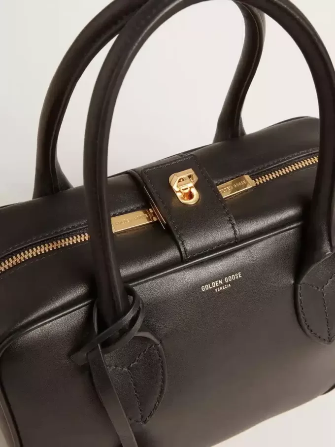 Vita-tas van glad zwart leer met gouden details