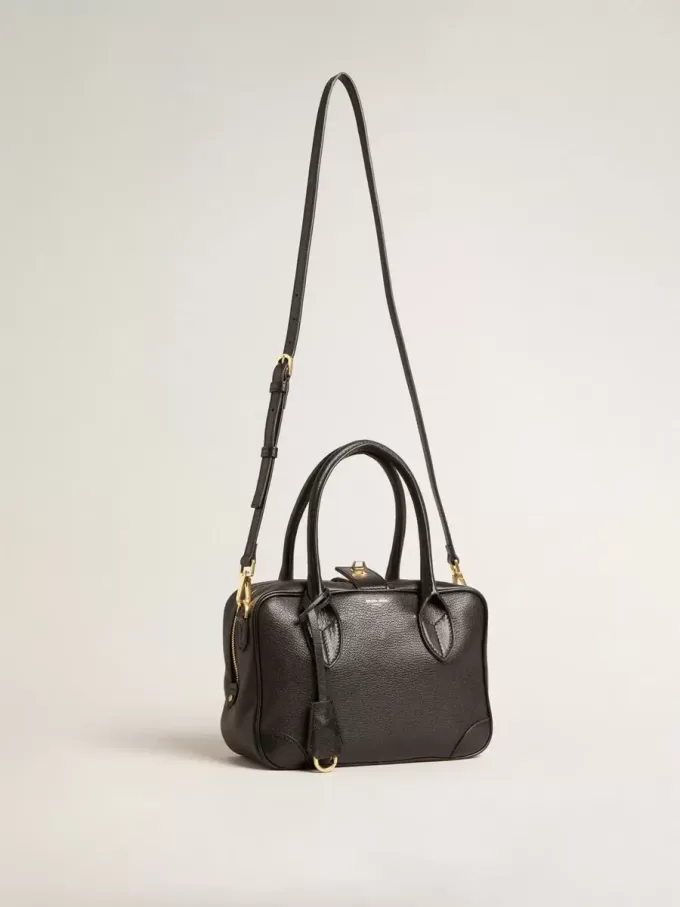 Vita-tas van zwart schapenleer met gouden details