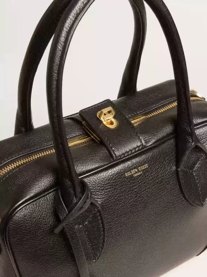 Vita-tas van zwart schapenleer met gouden details