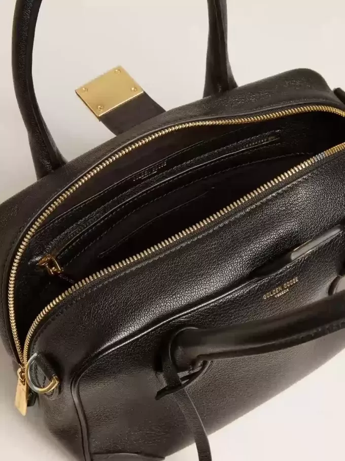Vita-tas van zwart schapenleer met gouden details