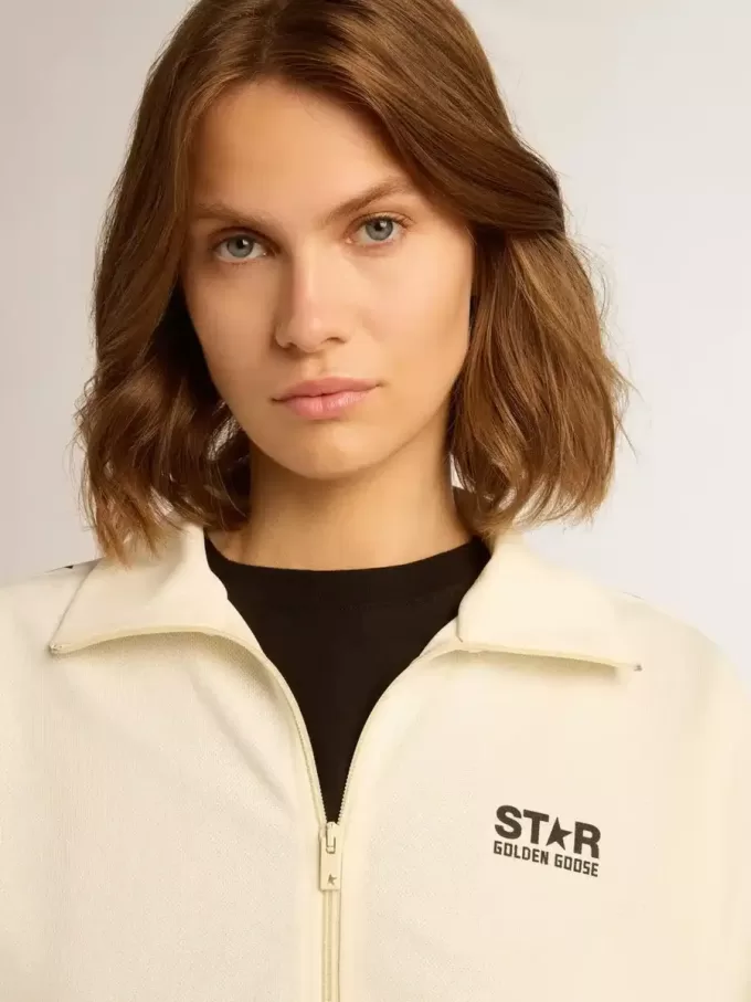 Wit damessweatshirt met ritssluiting, witte streep en zwarte sterren