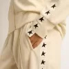 Wit damessweatshirt met ritssluiting, witte streep en zwarte sterren