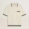 Wit gebreid poloshirt voor heren met blauwe boord