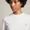 Wit T-shirt voor dames met zilveren glitterster op de voorkant