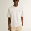 Wit unisex T-shirt met mediterrane print en Pescheria Golden-patch op de mouw