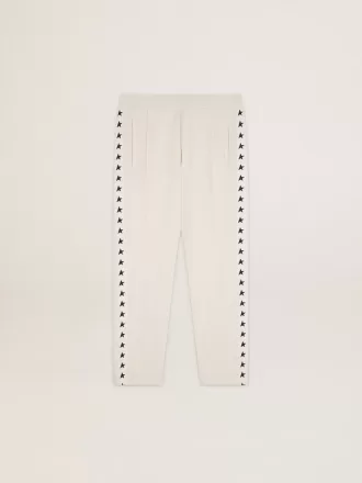 Witte joggingbroek voor heren met zwarte sterren aan de zijkanten
