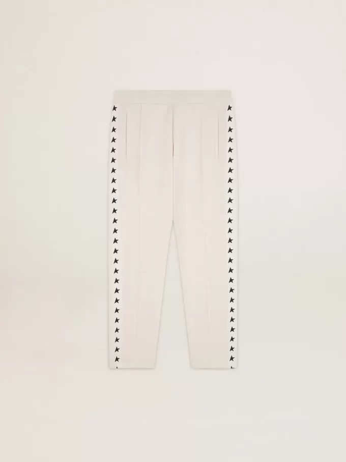 Witte joggingbroek voor heren met zwarte sterren aan de zijkanten