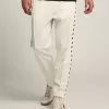 Witte joggingbroek voor heren met zwarte sterren aan de zijkanten