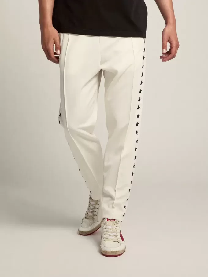 Witte joggingbroek voor heren met zwarte sterren aan de zijkanten