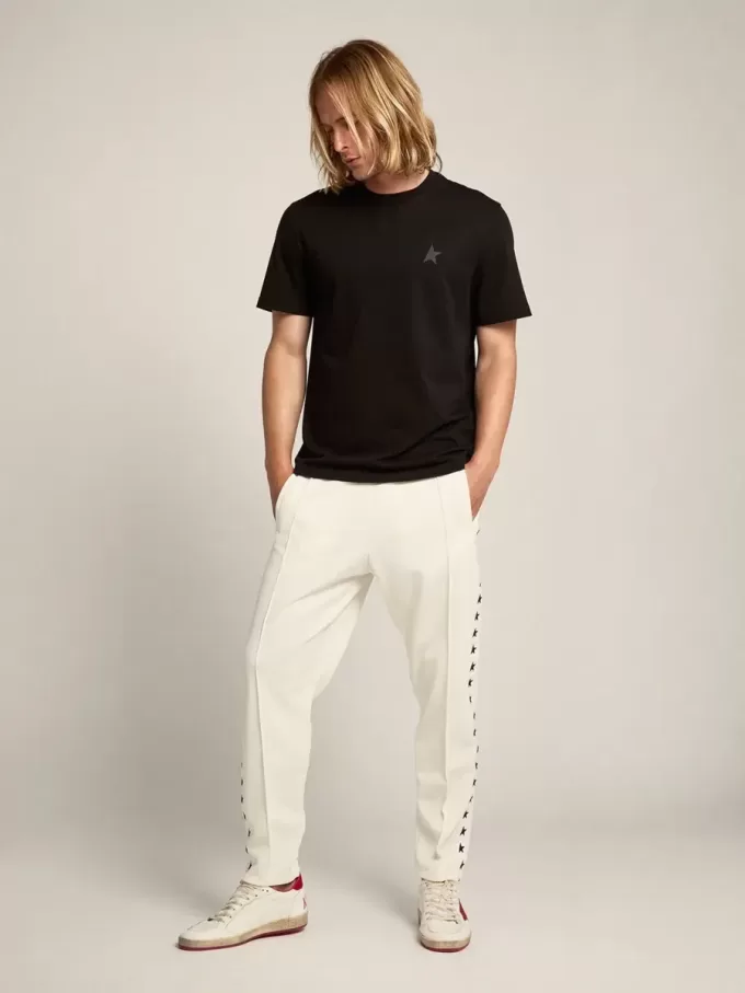 Witte joggingbroek voor heren met zwarte sterren aan de zijkanten