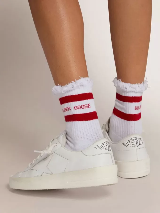 Witte sokken met distressed details en rode strepen