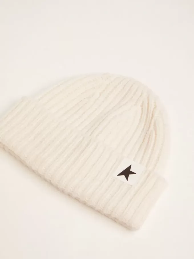 Witte wollen muts met zwarte ster