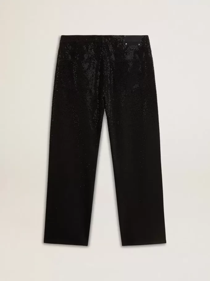 Zwarte herenjeans met een losse pasvorm en een all-over kristallen met kleurverloop.