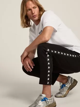 Zwarte joggingbroek voor heren met witte sterren aan de zijkanten