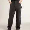 Zwarte katoenen damesjeans met slijtage-effect en patches aan de voorkant