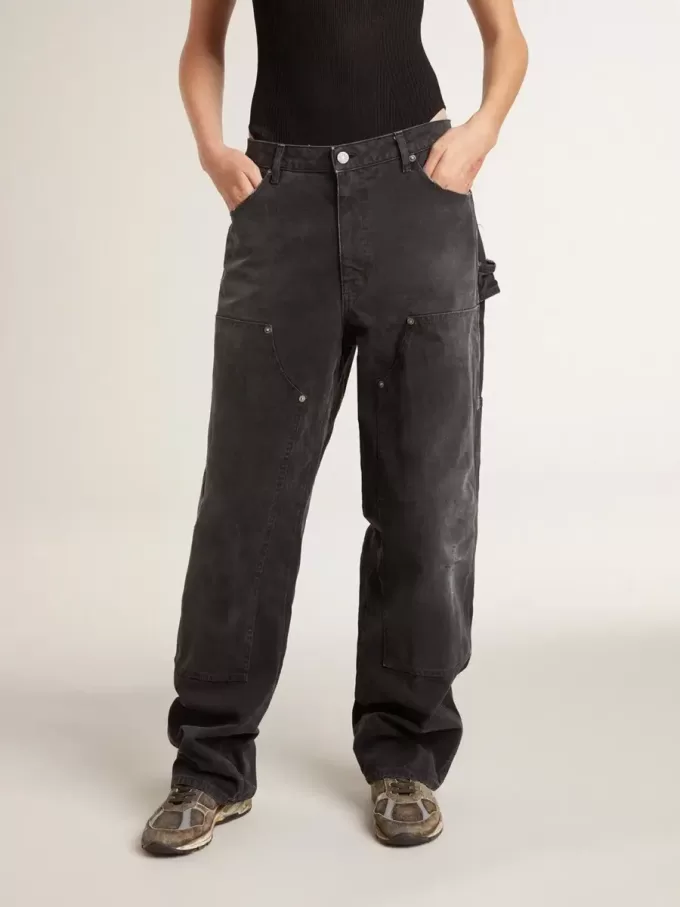 Zwarte katoenen damesjeans met slijtage-effect en patches aan de voorkant
