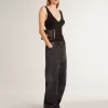 Zwarte katoenen damesjeans met slijtage-effect en patches aan de voorkant