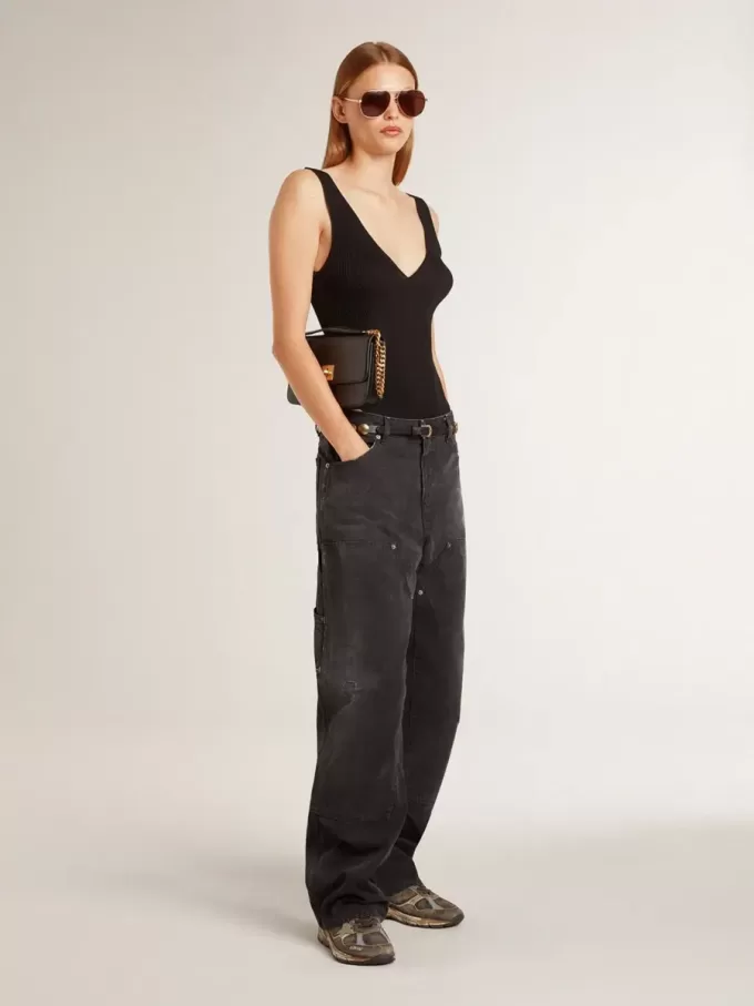 Zwarte katoenen damesjeans met slijtage-effect en patches aan de voorkant