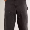 Zwarte katoenen damesjeans met slijtage-effect en patches aan de voorkant