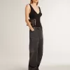 Zwarte katoenen damesjeans met slijtage-effect en patches aan de voorkant